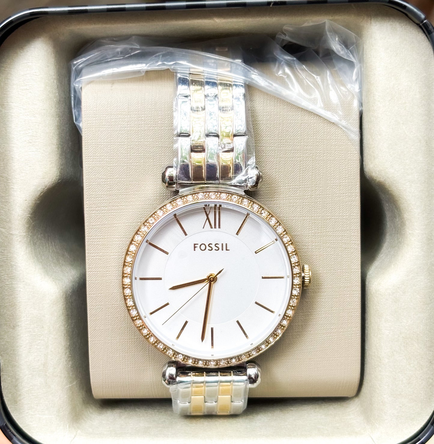 Reloj Fossil dorado con plateado.