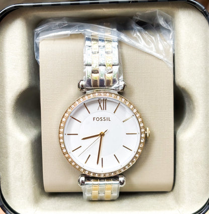 Reloj Fossil dorado con plateado.