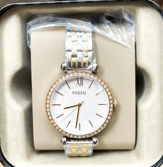 Reloj Fossil dorado con plateado.
